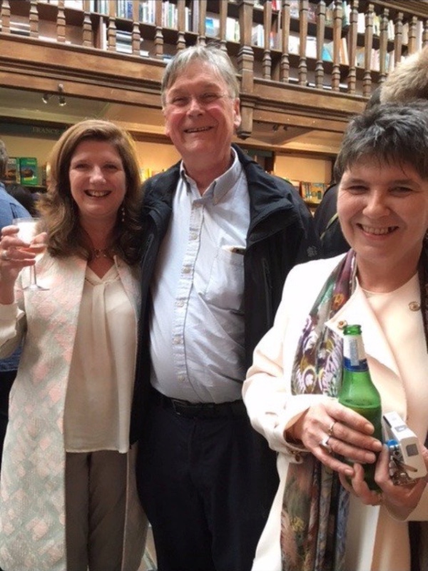Fiona Fox and her sister Claire with a smiling Tim Hunt