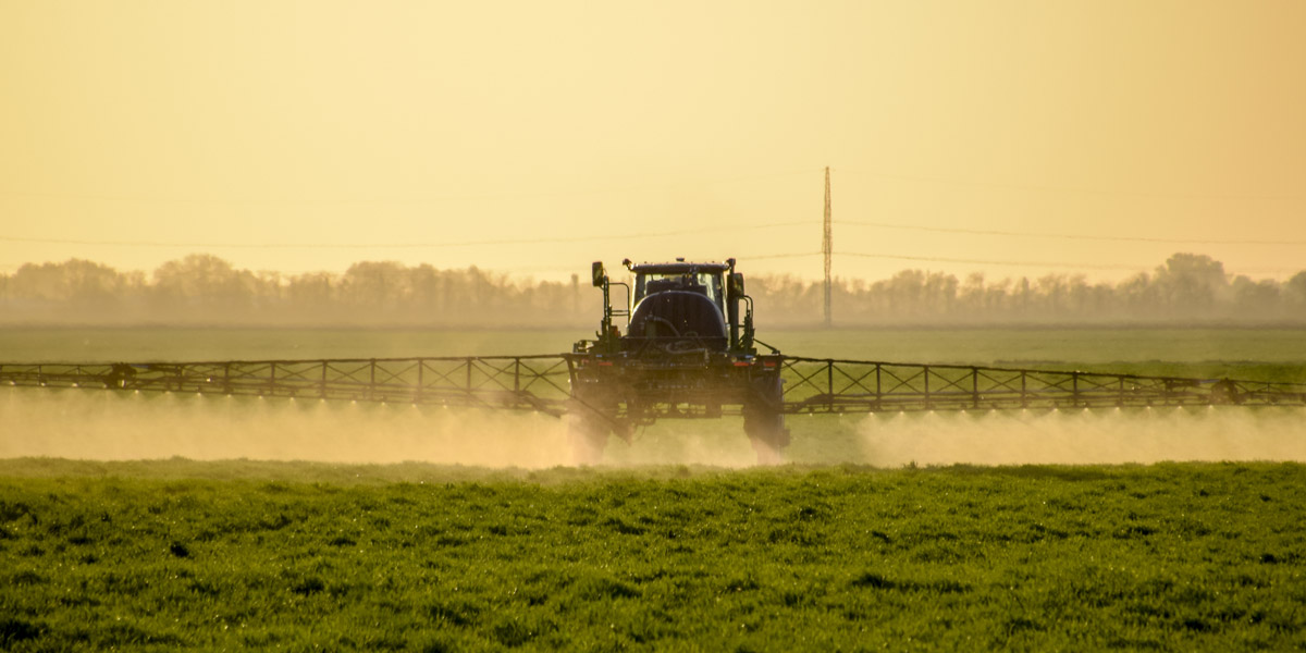 Tractor spraying roundup gylphosate